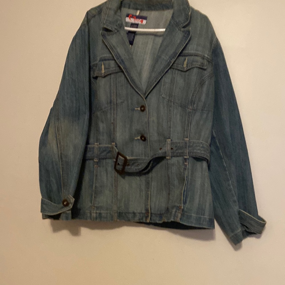 This jacket is a long sleeve blue Jean jacket size 22 with pockets and belt